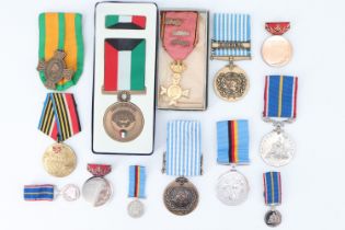 A Kuwait Liberation medal and sundry other medals