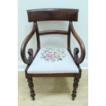 An early Victorian mahogany open armchair, having pronounced scroll arms