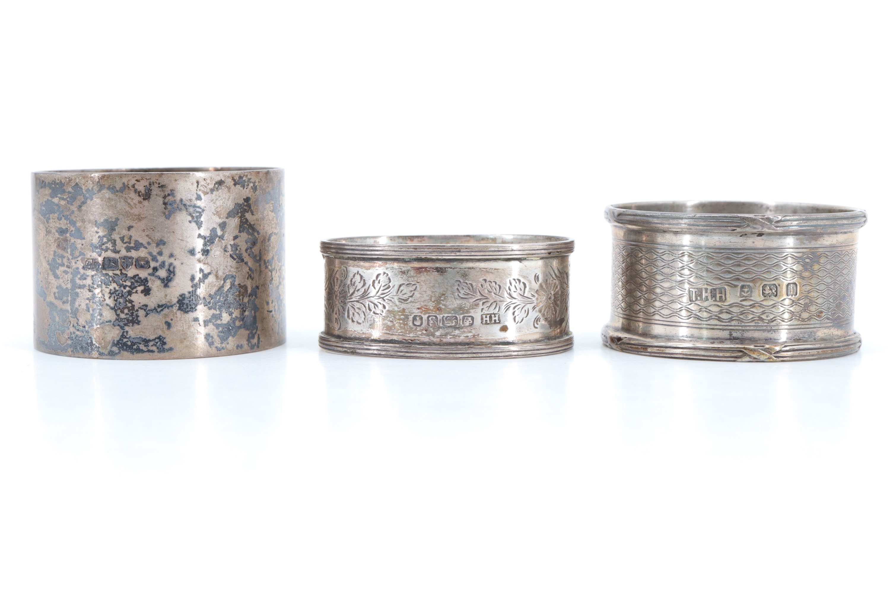 Three silver napkin rings, comprising a Victorian oval ring, having bright cut decoration, - Image 2 of 2