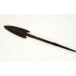 A medieval iron spear or arrow head, of barbed and tanged form, 18 cm
