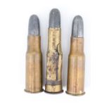 An inert Martini Henry rolled cartridge together with two drawn cartridges