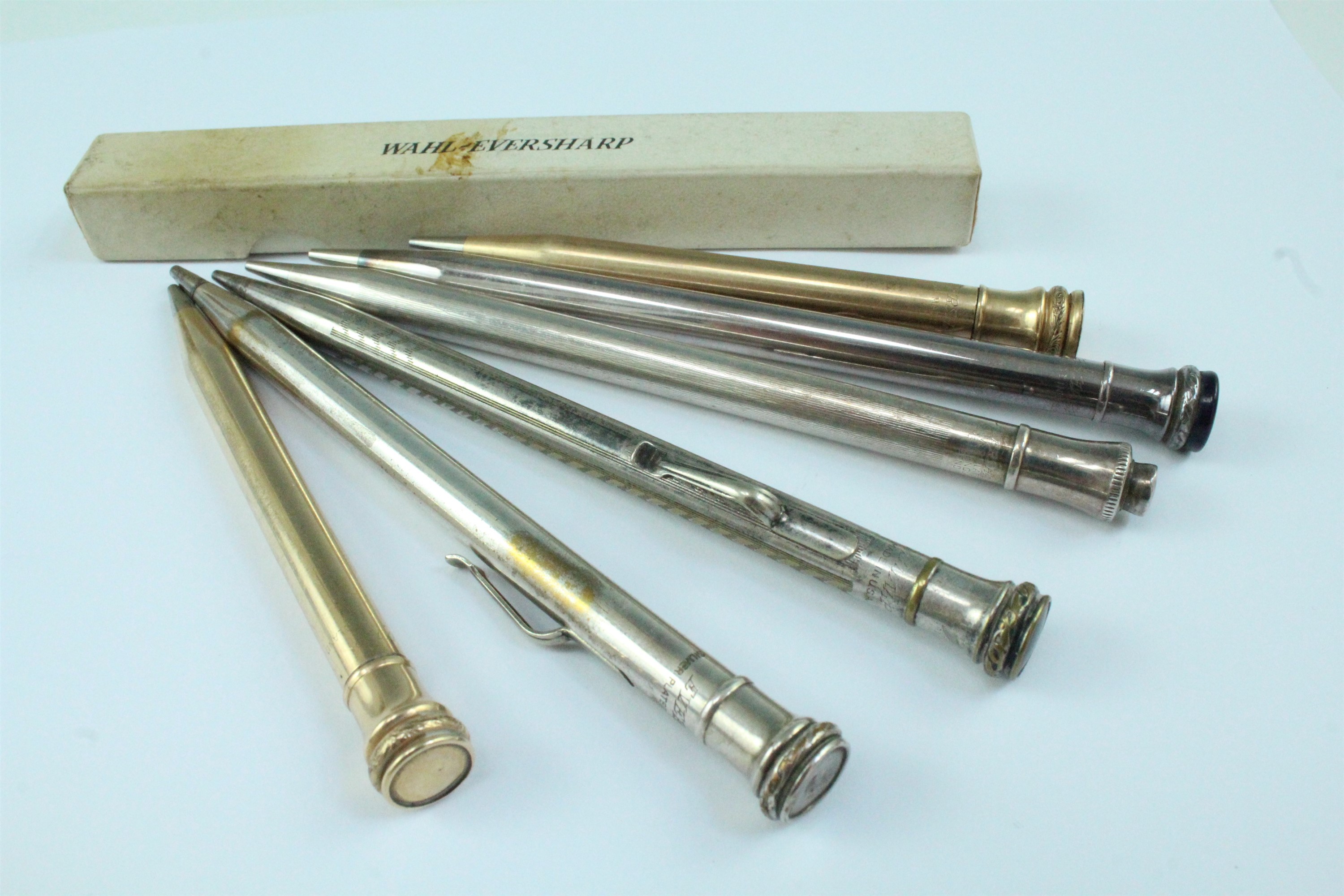 Six 'Eversharp' electroplated propelling pencils, one with box and instructions