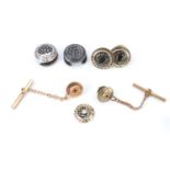 Procter and Gamble, a set of 1960s / 1970s silver and yellow metal long service buttons / tie studs,