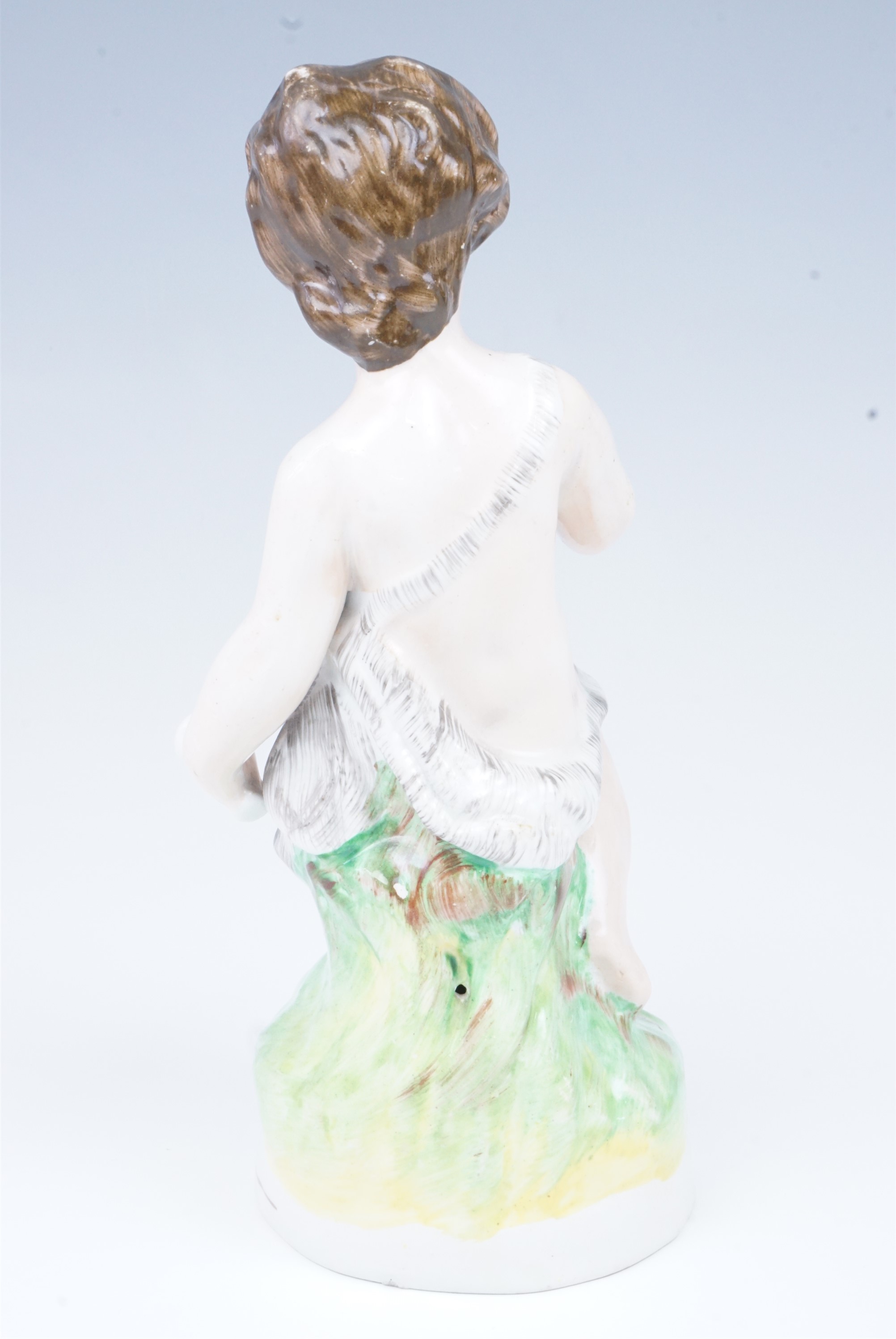 A late 19th Century Staffordshire figurine of a putto, 23.5 cm - Image 4 of 4