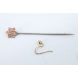 A late Victorian stick pin having a 9 ct gold terminal in the shape of a Star of David, together