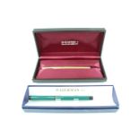 A 1980s Sheaffer gold electroplated cartridge fountain pen, the nib marked 14K, in a case,