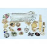A quantity of flamboyant vintage costume jewellery and watches including a late 20th Century