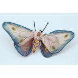 A hand made butterfly brooch, formed from stocking stretched over a wire frame and painted, second