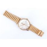 A 1980s Garrard 9 ct gold automatic gentleman's wristwatch, having a 21 jewel Swiss movement, a