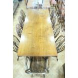 A reproduction oak refectory dining table together with ten Windsor chairs