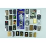 A quantity of vintage flip-top petrol lighters, including Flick, Zenith, Hadson, Mistral etc