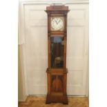 An Arts and Crafts / jugendstihl influenced oak long case clock, having an 8-day weight-driven two-