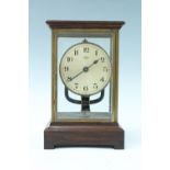 An early 20th Century Bulle electric clock, having an electromagnetic pendulum powered by a