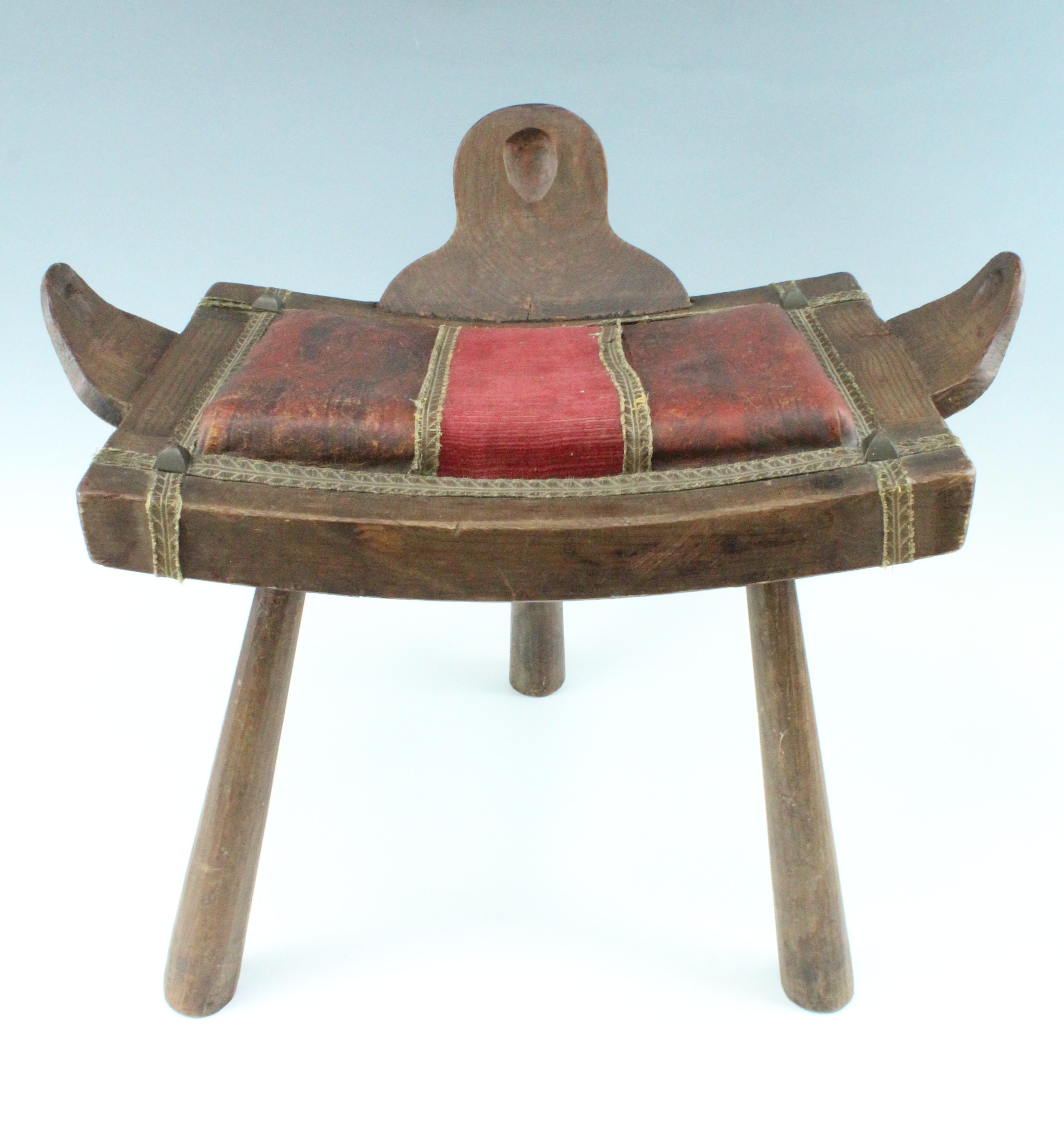 An early-to-mid 20th Century Middle Eastern style upholstered pine stool, 61 cm x 35 cm x 41 cm