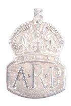 A 1938 silver ARP badge