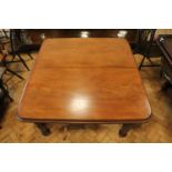 A Victorian mahogany wind-out dining table, having two leaves, 119 cm x 128 cm (plus two x 24 cm)