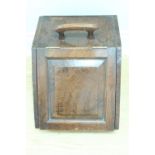 An early 20th Century oak coal box