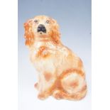 A Staffordshire spaniel figurine, having glass eyes, 32 cm