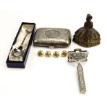 An electroplate cigarette case, safety razor, brass bell, four RAF tunic buttons and an RAF souvenir