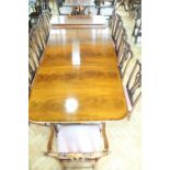 A quality and substantial reproduction Regency mahogany three-pillar dining table