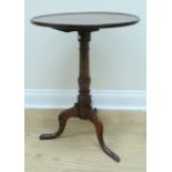 An early 19th Century oak tripod wine table, 50 cm x 71 cm