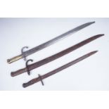 Two French Mle 1866 bayonets together with a British Pattern 1913 bayonet (lacking scabbard)