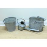 A galvanized 3/4 gallon watering can having a brass rose, together with two galvanized buckets,