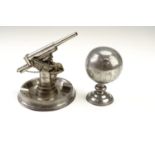 Two 1950s pewter novelty table lighters, being a petrol lighter in the form of an anti-aircraft gun,