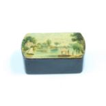 A Victorian lacquered pocket snuff box, its hinged lid decorated in depiction of a lake with