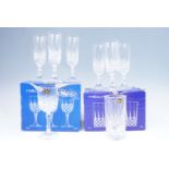 Boxed Melbourne wine glasses and spirits tumblers, together with six champagne flutes, tallest 19