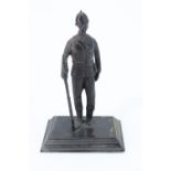A Victorian cast brass statuette of a British soldier modelled standing with Martini Henry rifle,