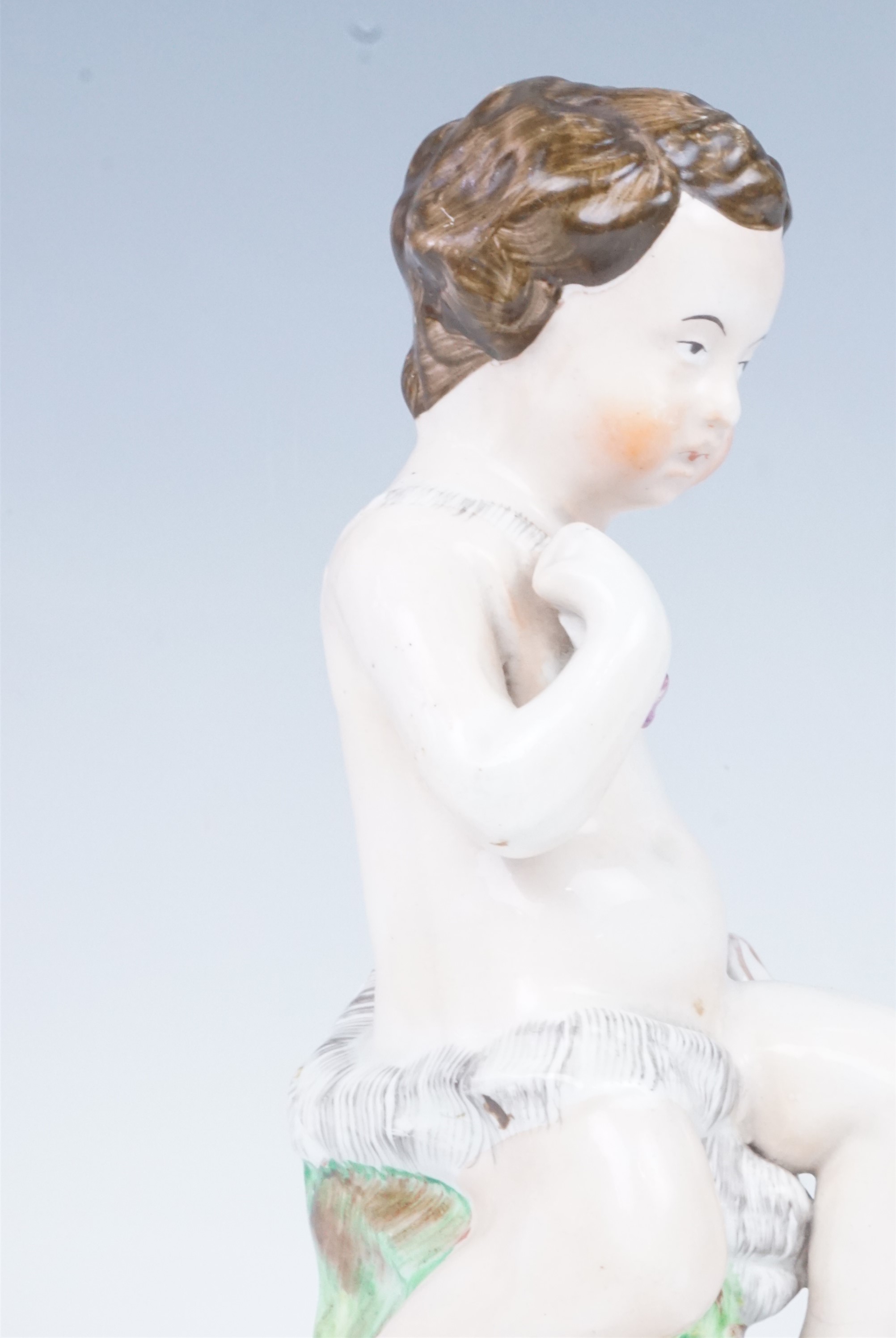 A late 19th Century Staffordshire figurine of a putto, 23.5 cm - Image 3 of 4
