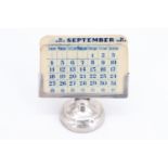 An early 20th Century silver perpetual desk calendar, 5 cm