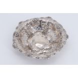 A Victorian silver bowl, having scalloped sides repousse decorated with shells, scrolls and