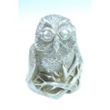 A pewter finished resin figure of an owl by Richard Fisher