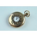 A half hunter rolled gold pocket watch, having a crown wind and set Swiss movement , 5 cm diameter