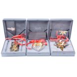 Three Georg Jensen gilt metal Christmas ornaments, 2010, 2012 and 2013, approx. 10 cm, boxed