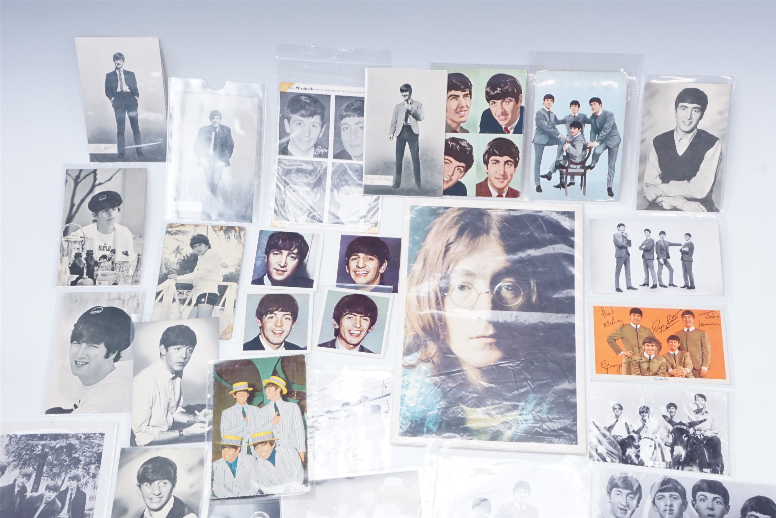 A group of The Beatles promotional photographs, postcards, a band calendar etc, circa 1960s - Image 2 of 3