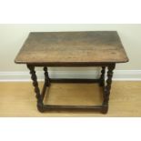 A late 17th / early 18th Century joined oak side table, having twist-turned legs, 91 cm x 55 cm x 72