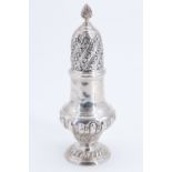 An impressive Edwardian silver sugar caster, of baluster form having a gadrooned lower body and