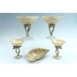 Two pairs of marble effect art glass tazzas and a conforming dish, tazzas 21.5 cm and 15 cm high