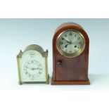 Two early 20th Century dome top mantle clocks, comprising a brass clock, having a French drum