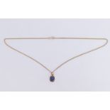A sapphire pendant, the cushion cut stone of approximately 2.5 ct set on yellow metal, together with