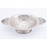 An early 20th Century silver two handled oval bowl, having an everted rim on a pedestal base, flat