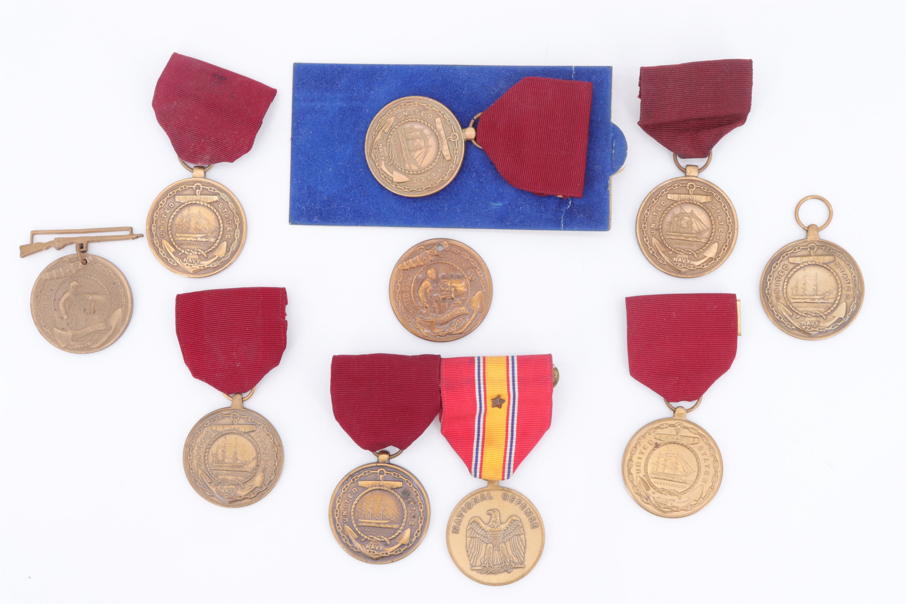 Seven US navy Good Conduct medals together with two Marine Corps examples
