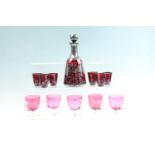 A 1930's silver overlaid liqueur set together with five ruby flashed custard cups