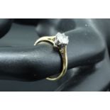 A .5 ct diamond solitaire ring, the brilliant cut stone platinum claw set on an 18 ct yellow metal