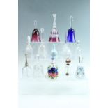 A collection of glass and other bells, including a Bohemian style flashed and enamelled glass