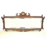 An unusual Chippendale influenced mahogany veneered wall mirror, being of horizontal oblong