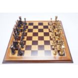 A brass classical Graeco Roman themed chess set, together with a marquetry chess board, king 10 cm